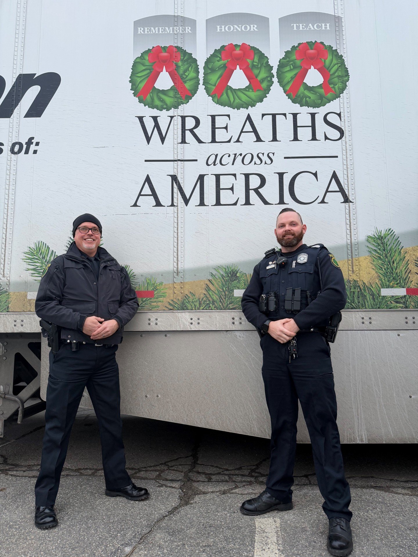 Sergeant Dickens and Officer Stanwood in front of a Wreaths Across America truck