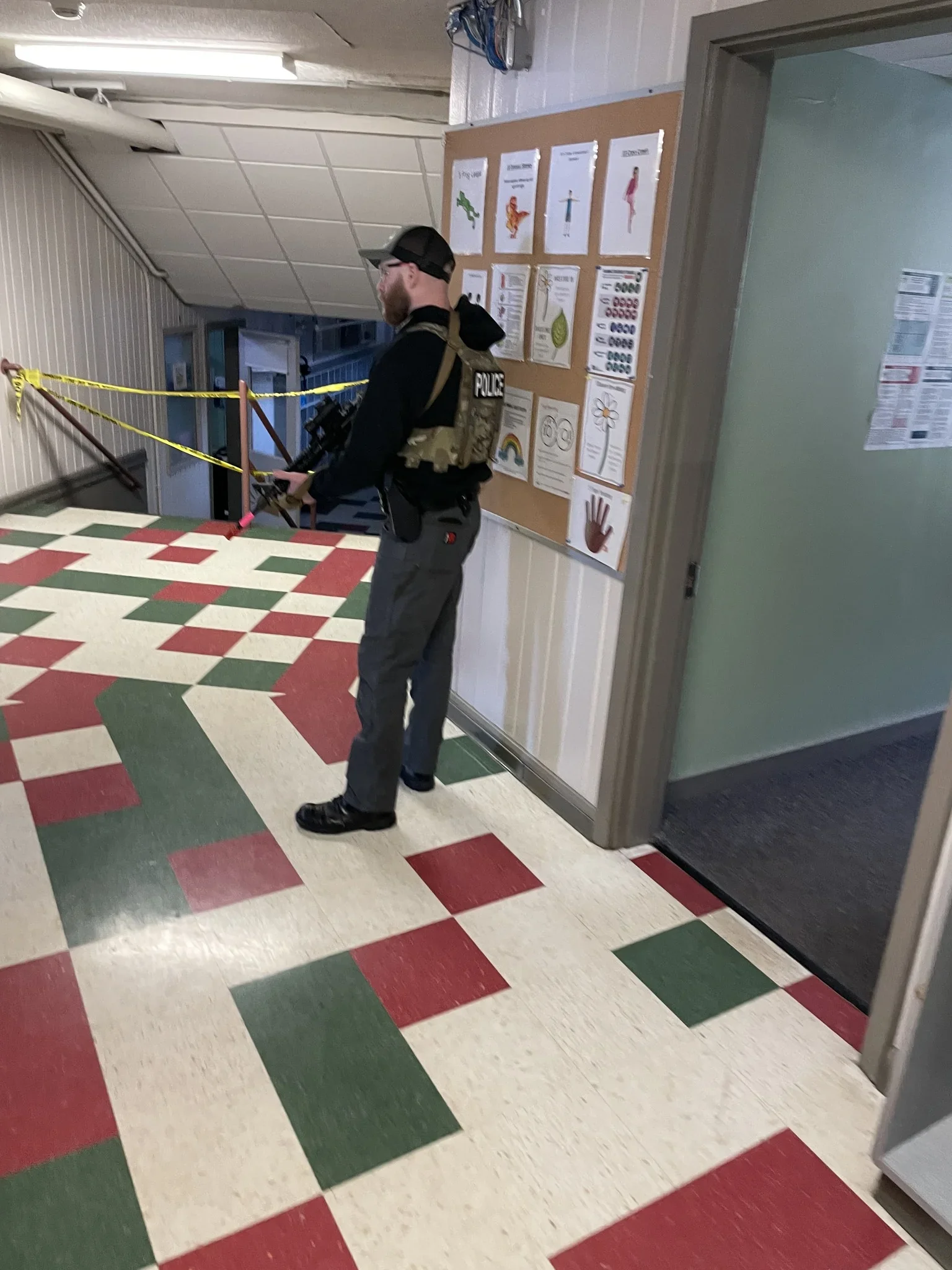 Officers participating in active threat training scenarios